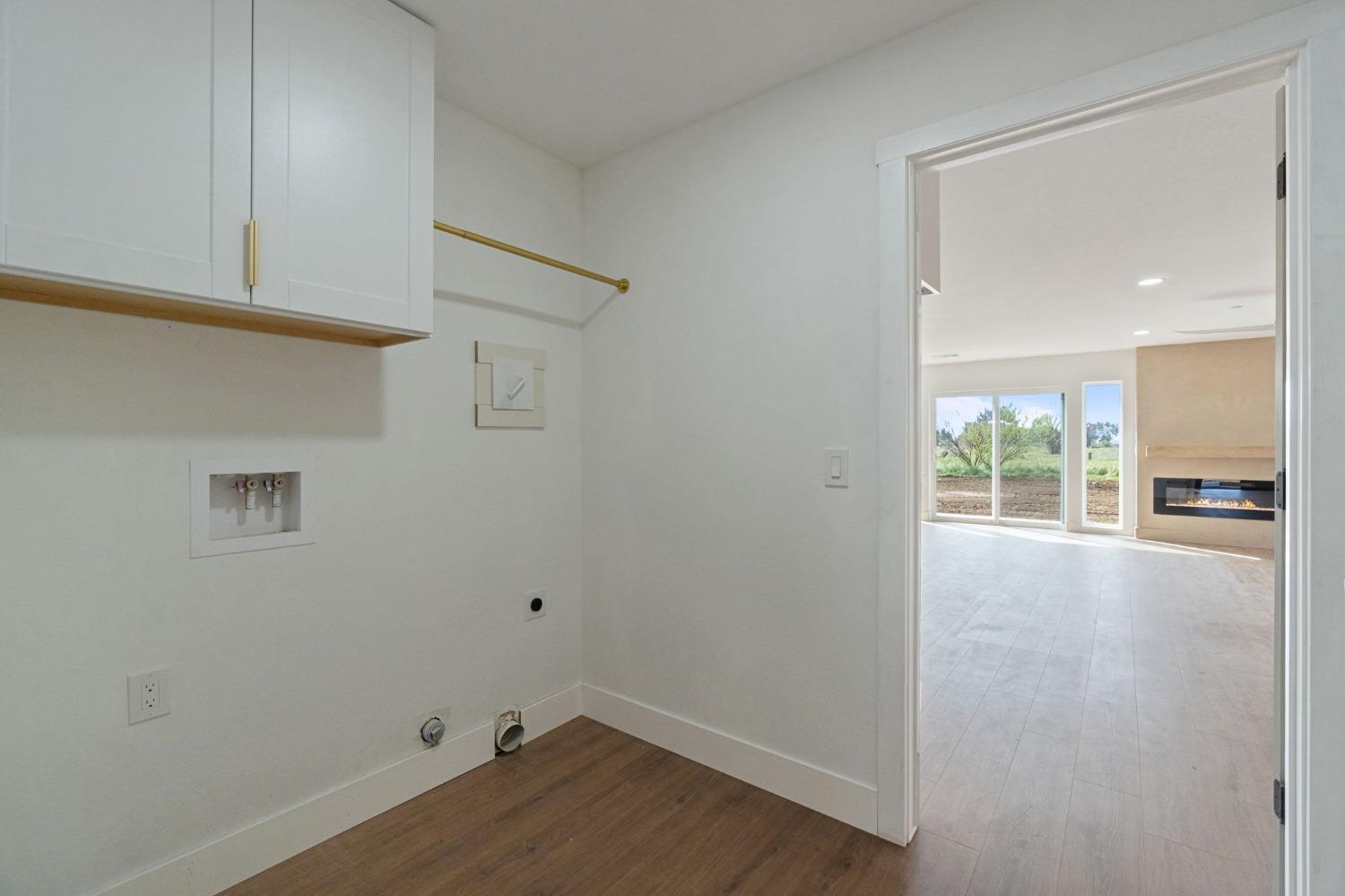 25918 Tanforan Drive Madera, CA 93638 - Photo 22 of 37 a view of a kitchen with wooden floor and a window