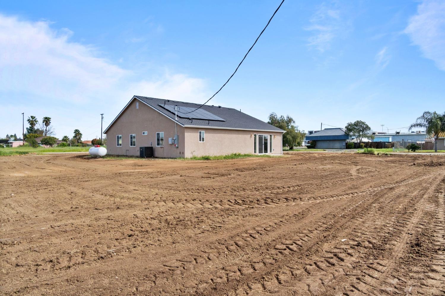 25918 Tanforan Drive Madera, CA 93638 - Photo 34 of 37 a view of a house with a yard