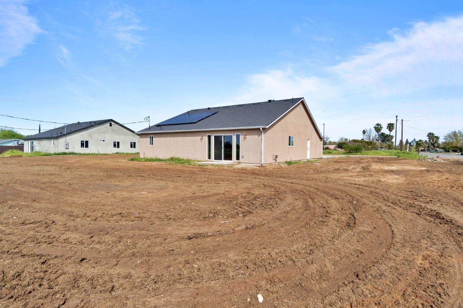 25918 Tanforan Drive Madera, CA 93638 - Photo 35 of 37 a view of house with backyard and trees