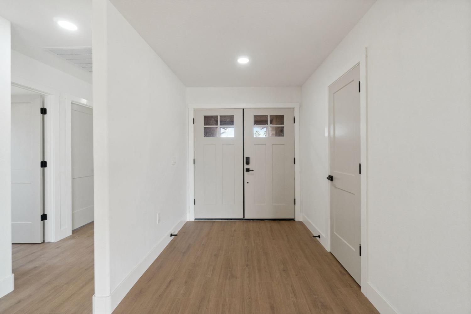25918 Tanforan Drive Madera, CA 93638 - Photo 5 of 37 a view of hallway with wooden floor