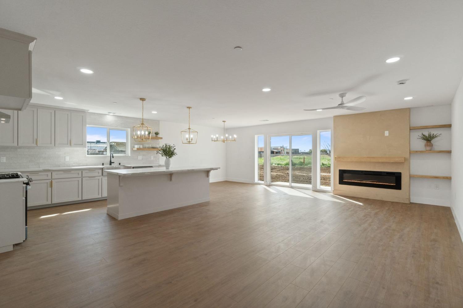 25918 Tanforan Drive Madera, CA 93638 - Photo 6 of 37 a large white kitchen with a large window