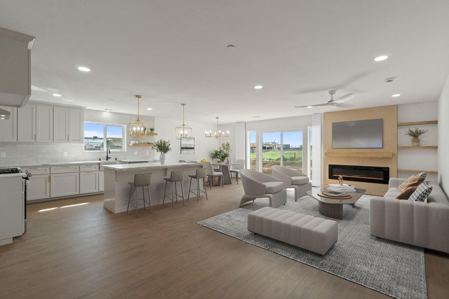 25918 Tanforan Drive Madera, CA 93638 - Photo 7 of 37 a living room with fireplace furniture and a large window