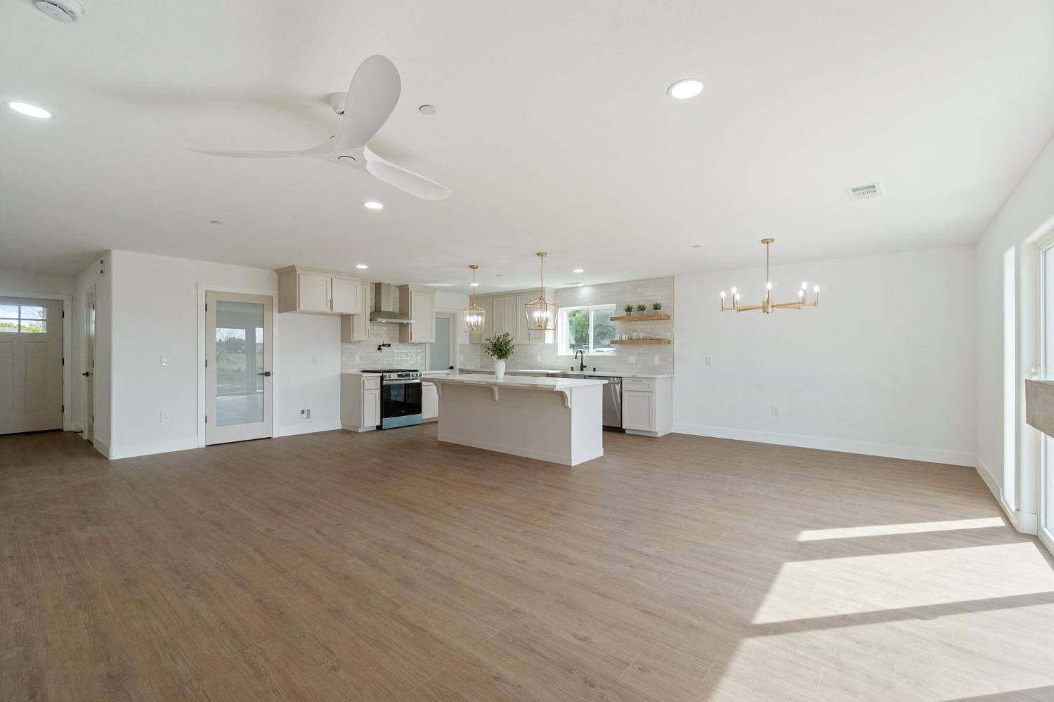 25918 Tanforan Drive Madera, CA 93638 - Photo 9 of 37 a view of a kitchen with a sink dishwasher white cabinets and refrigerator