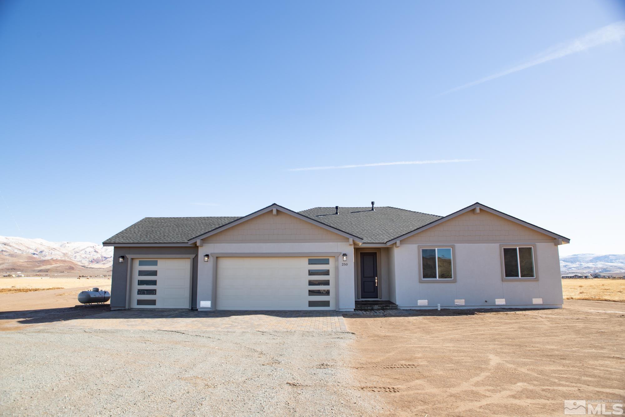 250 Paloma Ranch Court Reno, NV 89510 - Photo 1 of 35 a view of a house with a yard and garage