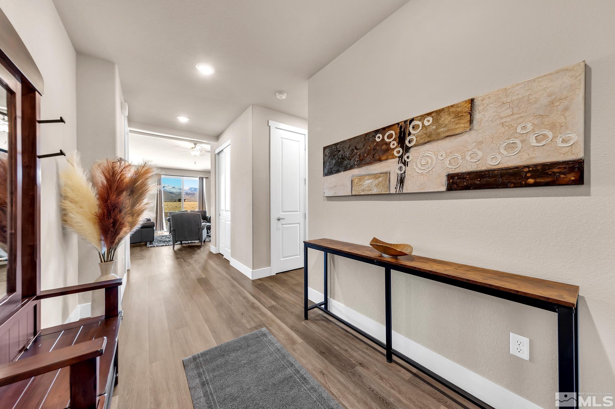 250 Paloma Ranch Court Reno, NV 89510 - Photo 17 of 35 a hallway with wooden floor stairs and furniture