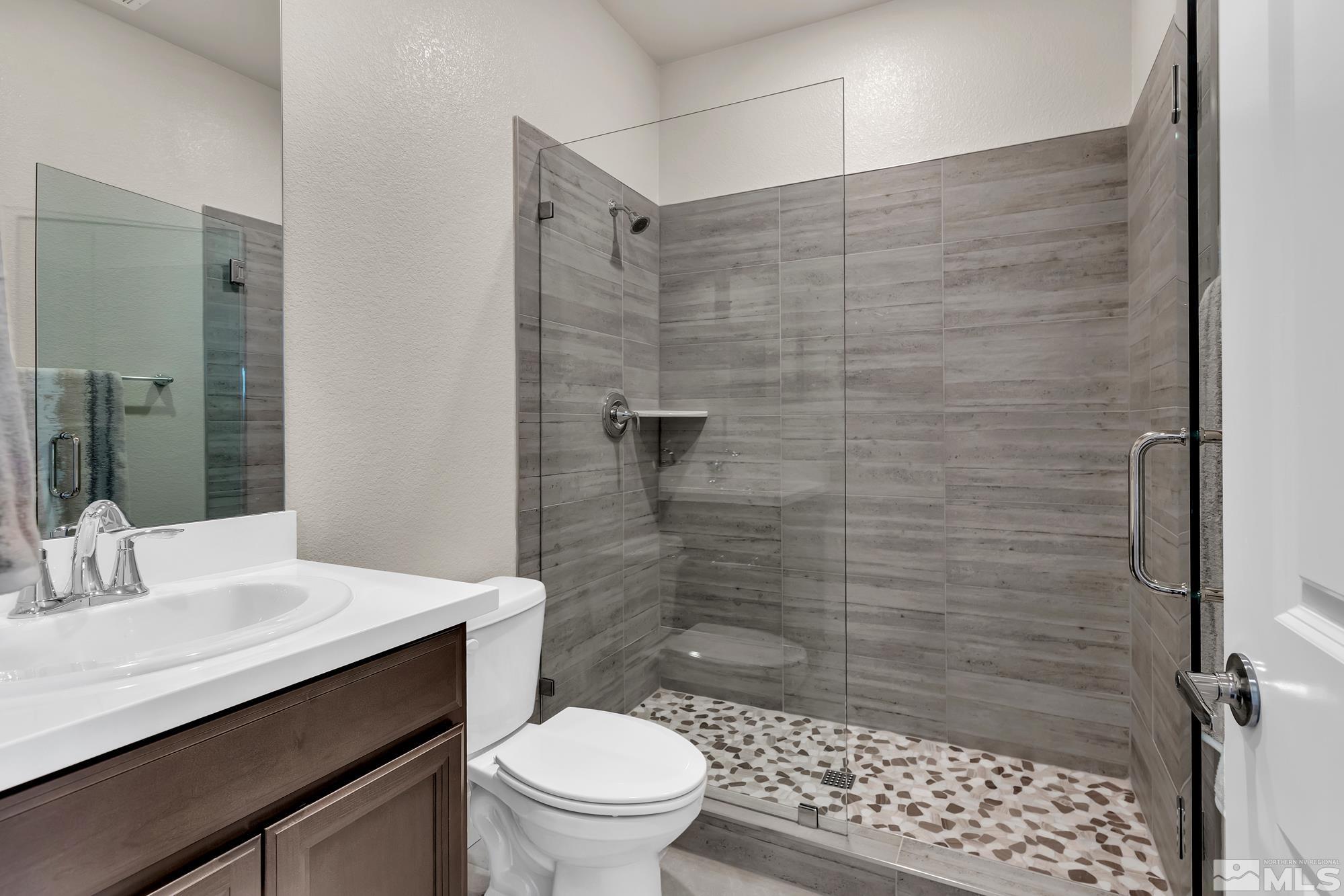 250 Paloma Ranch Court Reno, NV 89510 - Photo 18 of 35 a bathroom with a sink a toilet and shower