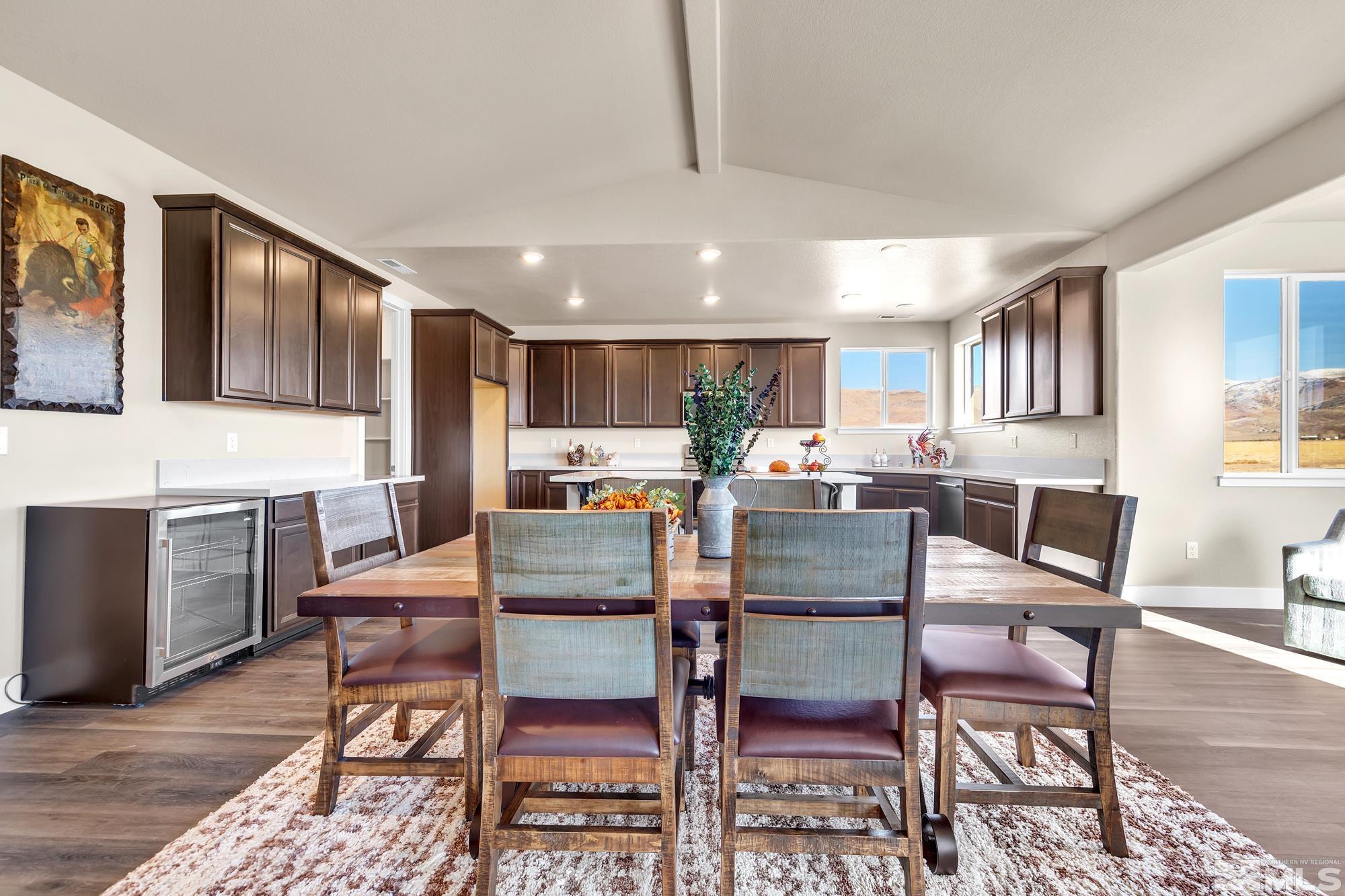 250 Paloma Ranch Court Reno, NV 89510 - Photo 26 of 35 a dining room with a table chairs and a kitchen view