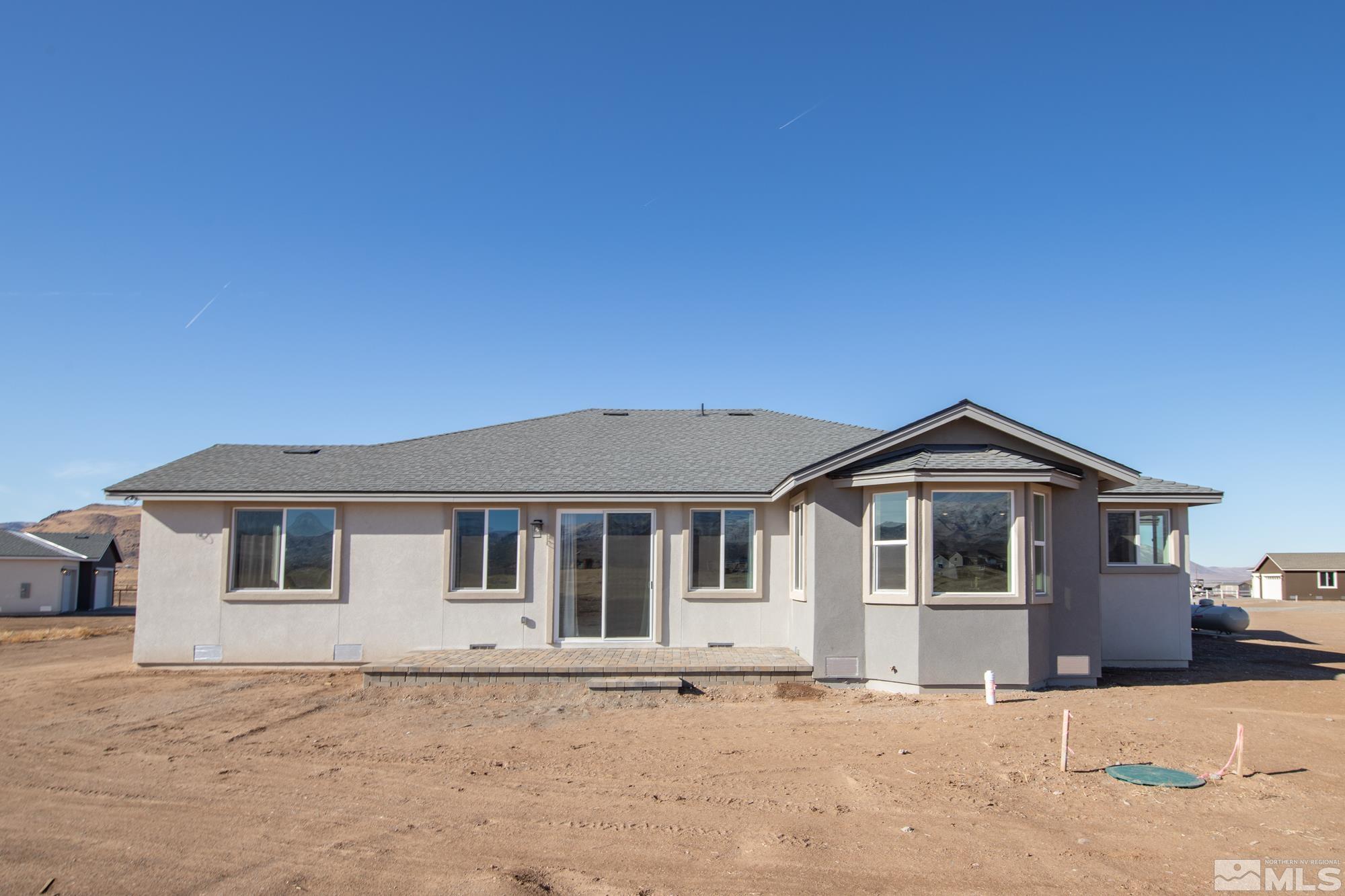 250 Paloma Ranch Court Reno, NV 89510 - Photo 4 of 35 a front view of a house with a yard