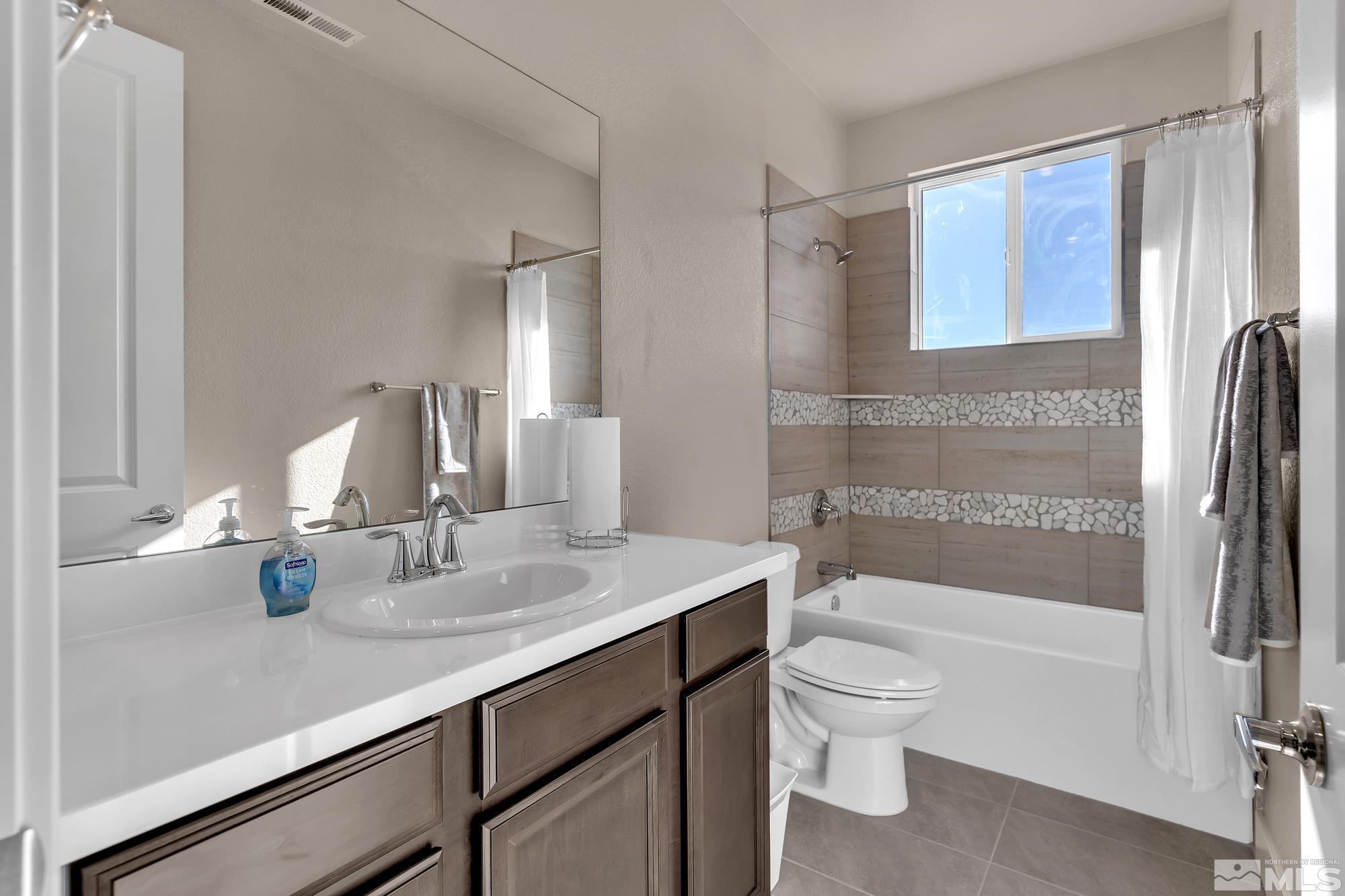 250 Paloma Ranch Court Reno, NV 89510 - Photo 9 of 35 a bathroom with a sink a toilet and shower