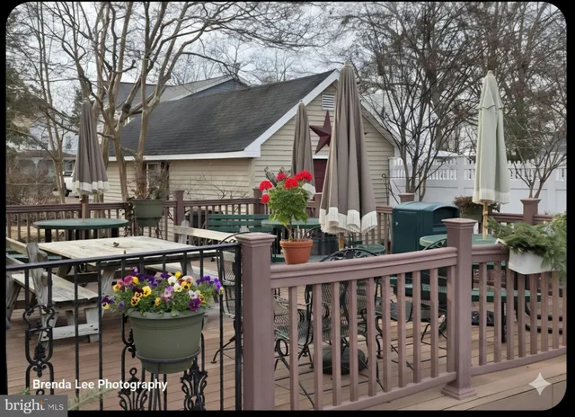 a front view of a house with a tree