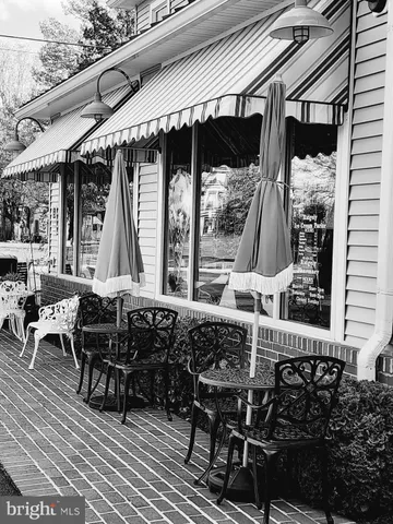 a view of a street with trees all around