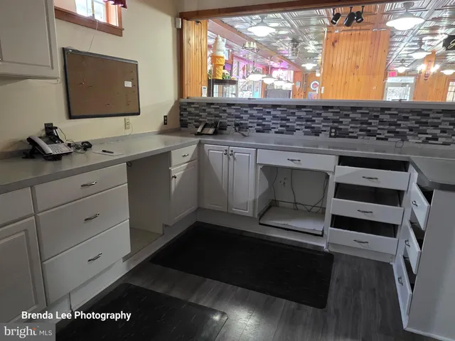 a view of kitchen with furniture and window