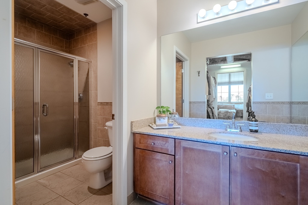 160 Fremont Street, Unit 405 Worcester, MA 01603 - Photo 20 of 34 a bathroom with a sink toilet and shower