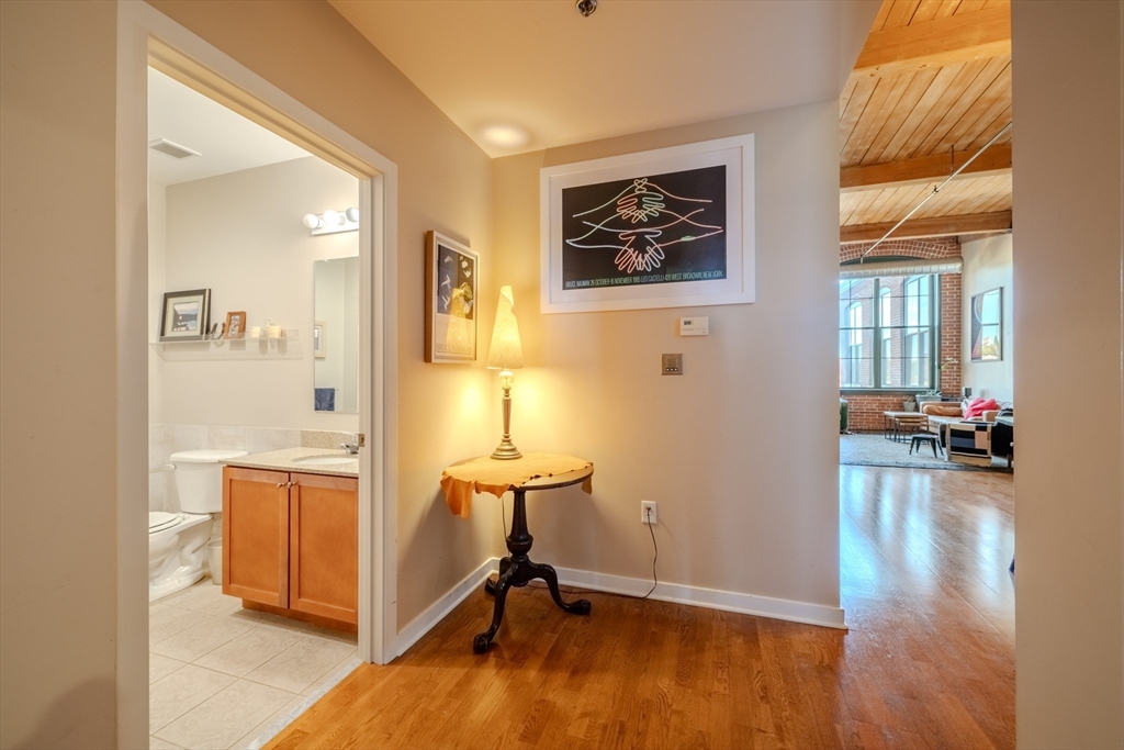 160 Fremont Street, Unit 405 Worcester, MA 01603 - Photo 22 of 34 a view of a livingroom with wooden floor and furniture
