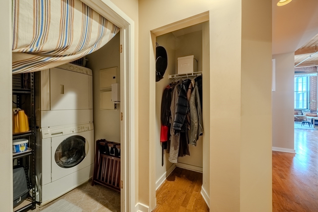 160 Fremont Street, Unit 405 Worcester, MA 01603 - Photo 27 of 34 a view of a hallway with washer and dryer