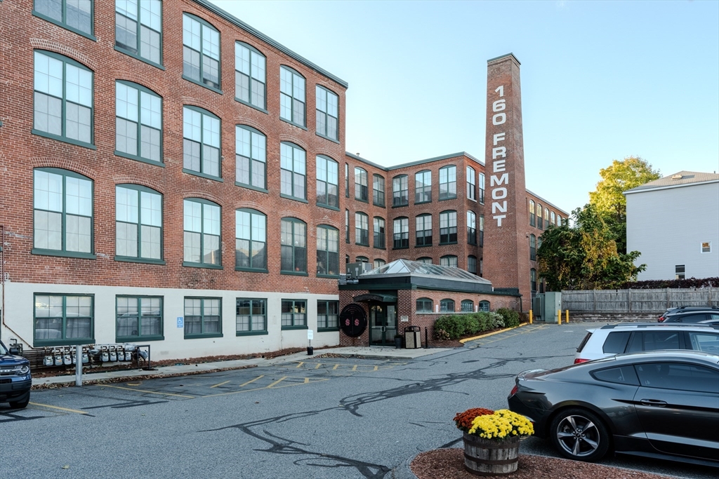160 Fremont Street, Unit 405 Worcester, MA 01603 - Photo 33 of 34 a car parked in front of a building