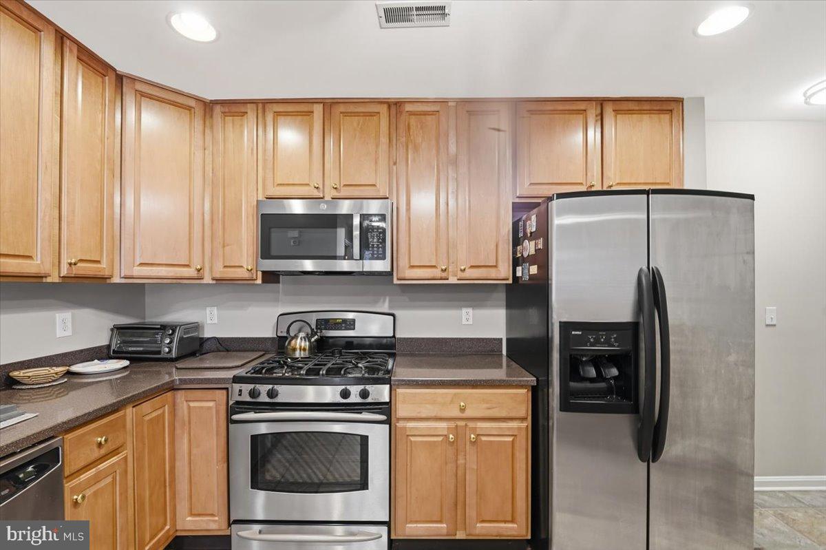 192 Federal Point Boulevard Lawrenceville, NJ 08648 - Photo 12 of 34 a kitchen with stainless steel appliances granite countertop a stove a refrigerator and a microwave