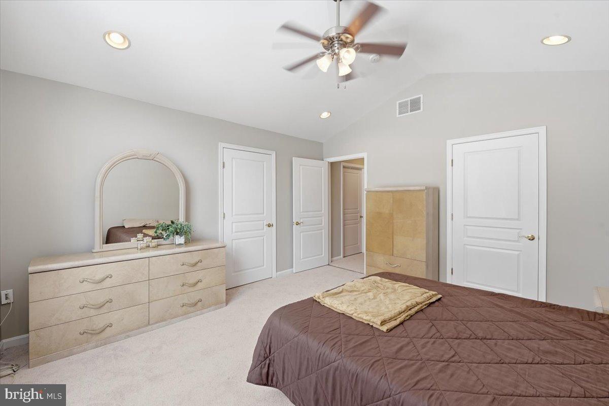 192 Federal Point Boulevard Lawrenceville, NJ 08648 - Photo 15 of 34 a bedroom with a large bed and a dresser