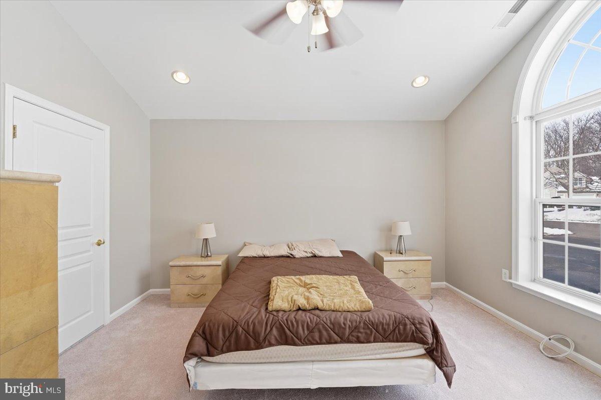 192 Federal Point Boulevard Lawrenceville, NJ 08648 - Photo 17 of 34 a bedroom with a bed and a window