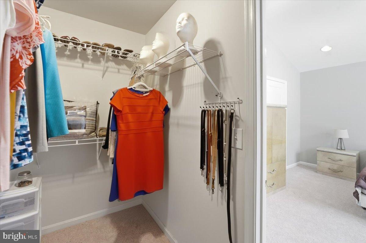192 Federal Point Boulevard Lawrenceville, NJ 08648 - Photo 19 of 34 a view of walk in closet with clothes and shoes