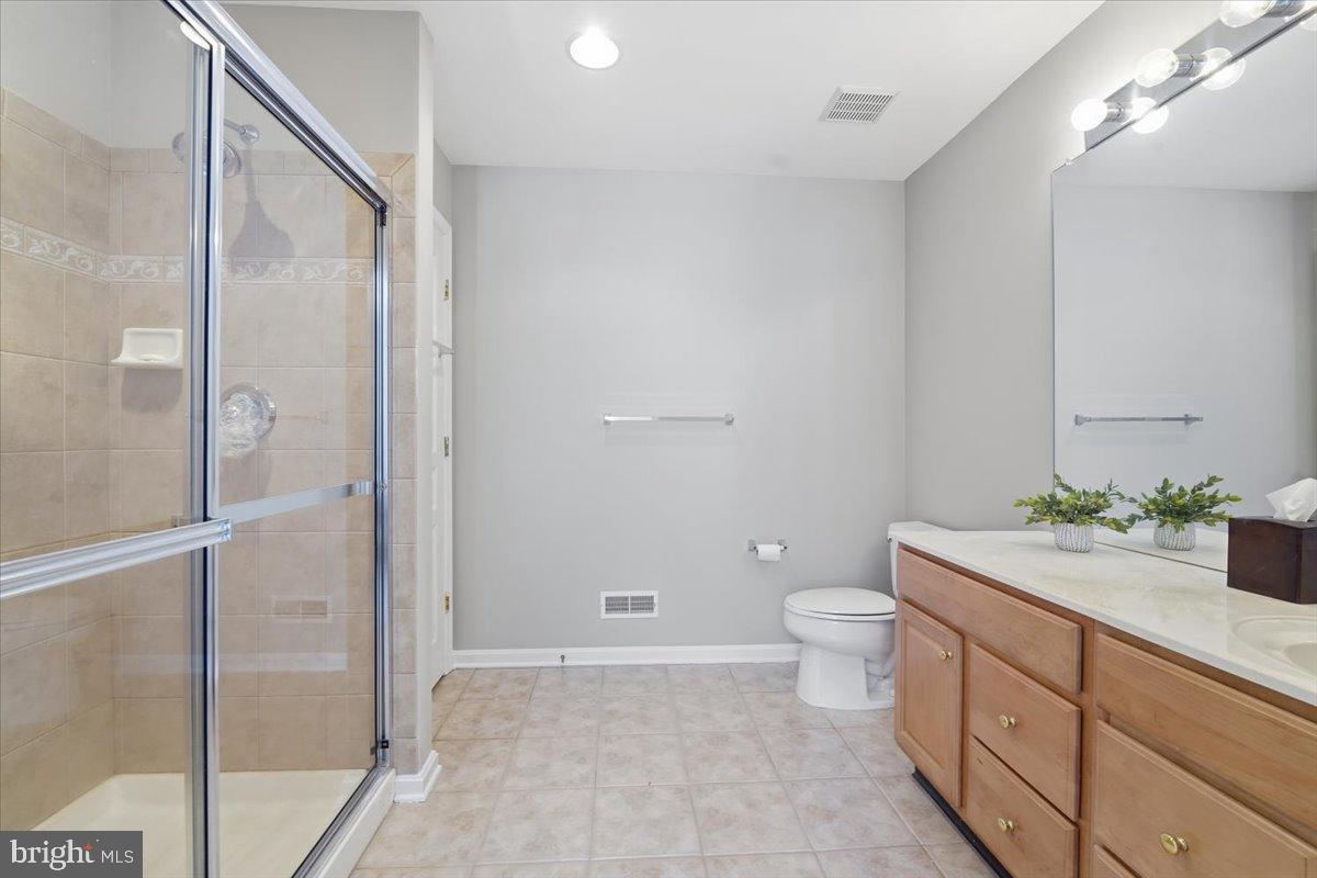192 Federal Point Boulevard Lawrenceville, NJ 08648 - Photo 22 of 34 a bathroom with a double vanity sink toilet and a mirror