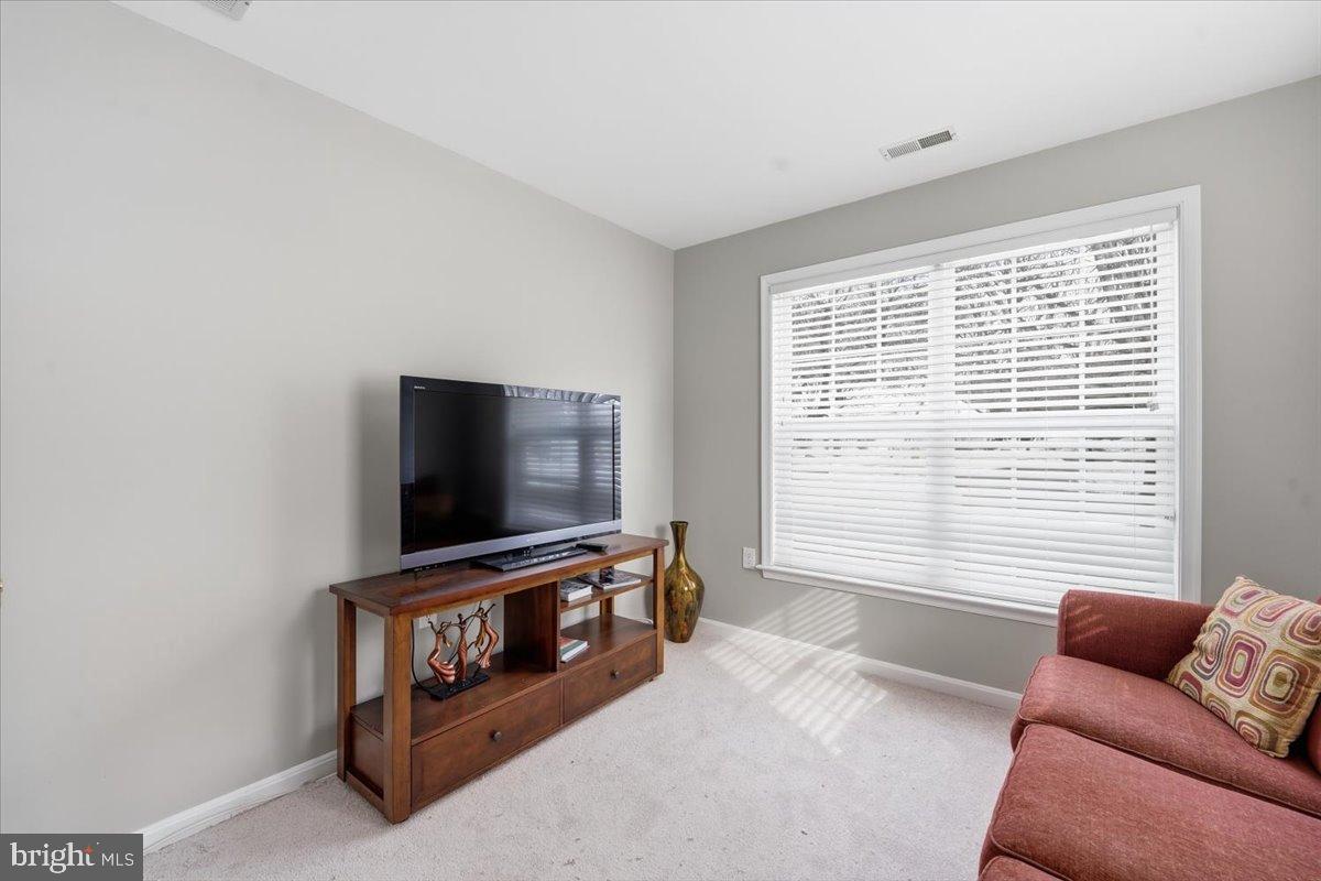 192 Federal Point Boulevard Lawrenceville, NJ 08648 - Photo 23 of 34 a living room with furniture and a flat screen tv