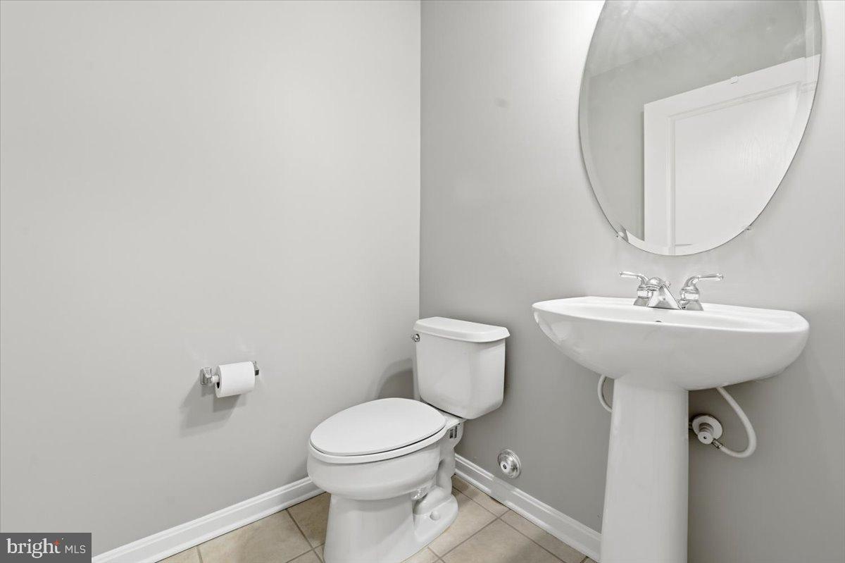 192 Federal Point Boulevard Lawrenceville, NJ 08648 - Photo 31 of 34 a bathroom with a toilet sink and mirror