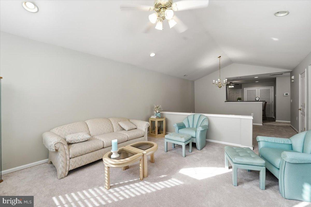 192 Federal Point Boulevard Lawrenceville, NJ 08648 - Photo 7 of 34 a living room with furniture and a chandelier