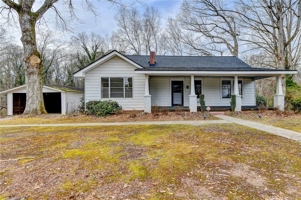 123 Clarks Bridge Road Gainesville, GA 30501 - Photo 1 of 1 a view of a house with backyard and swimming pool
