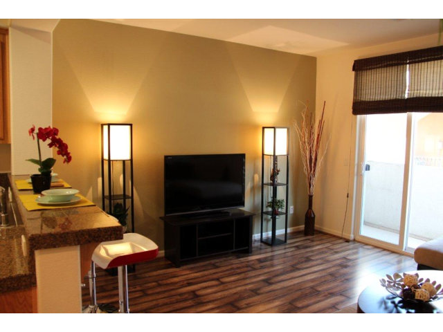 69 Ede Lane Milpitas, CA 95035 - Photo 2 of 17 a living room with furniture and a flat screen tv