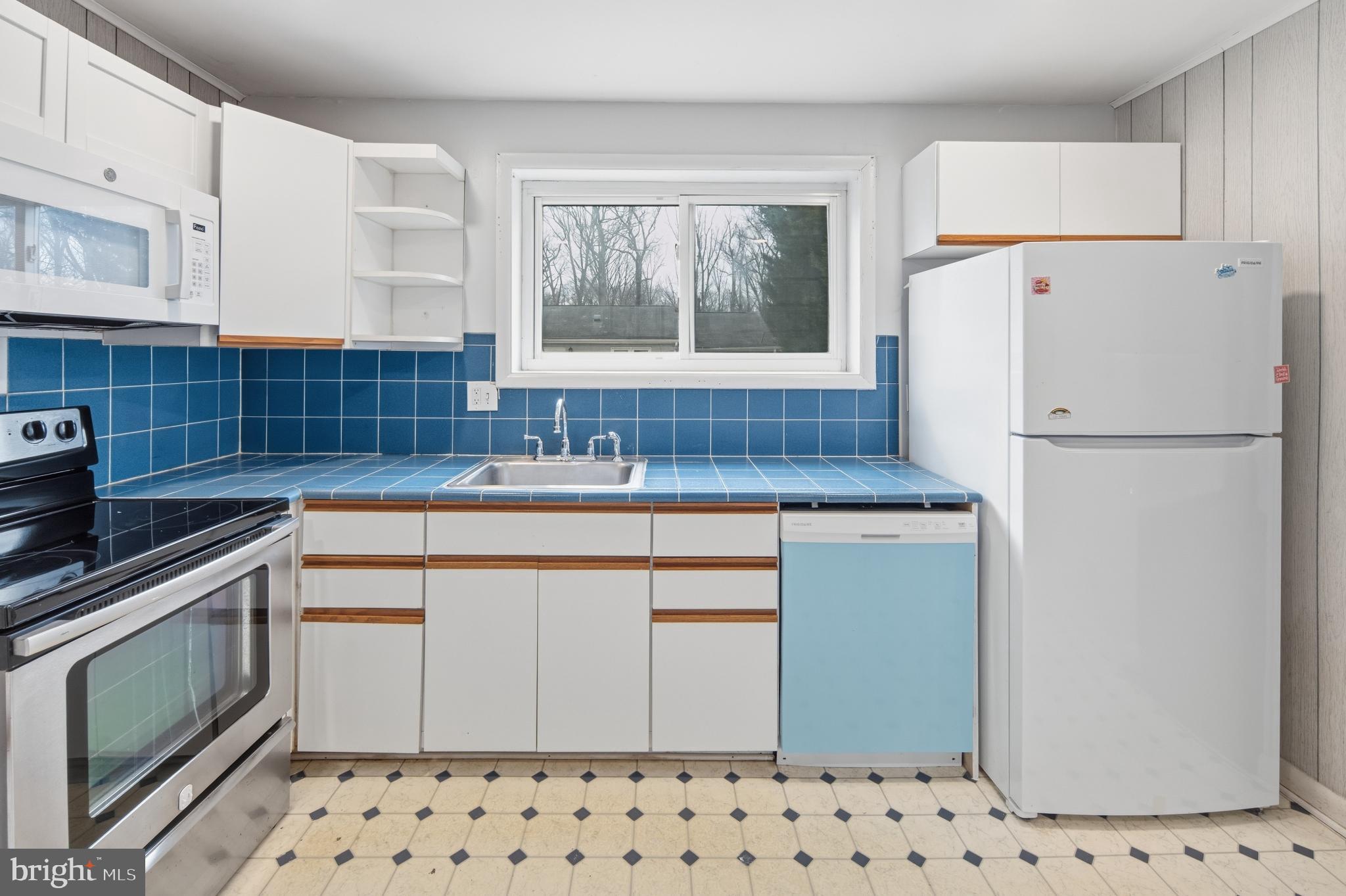 3505 N Street Southeast Washington, DC 20019 - Photo 14 of 29 a kitchen with sink a refrigerator and a stove