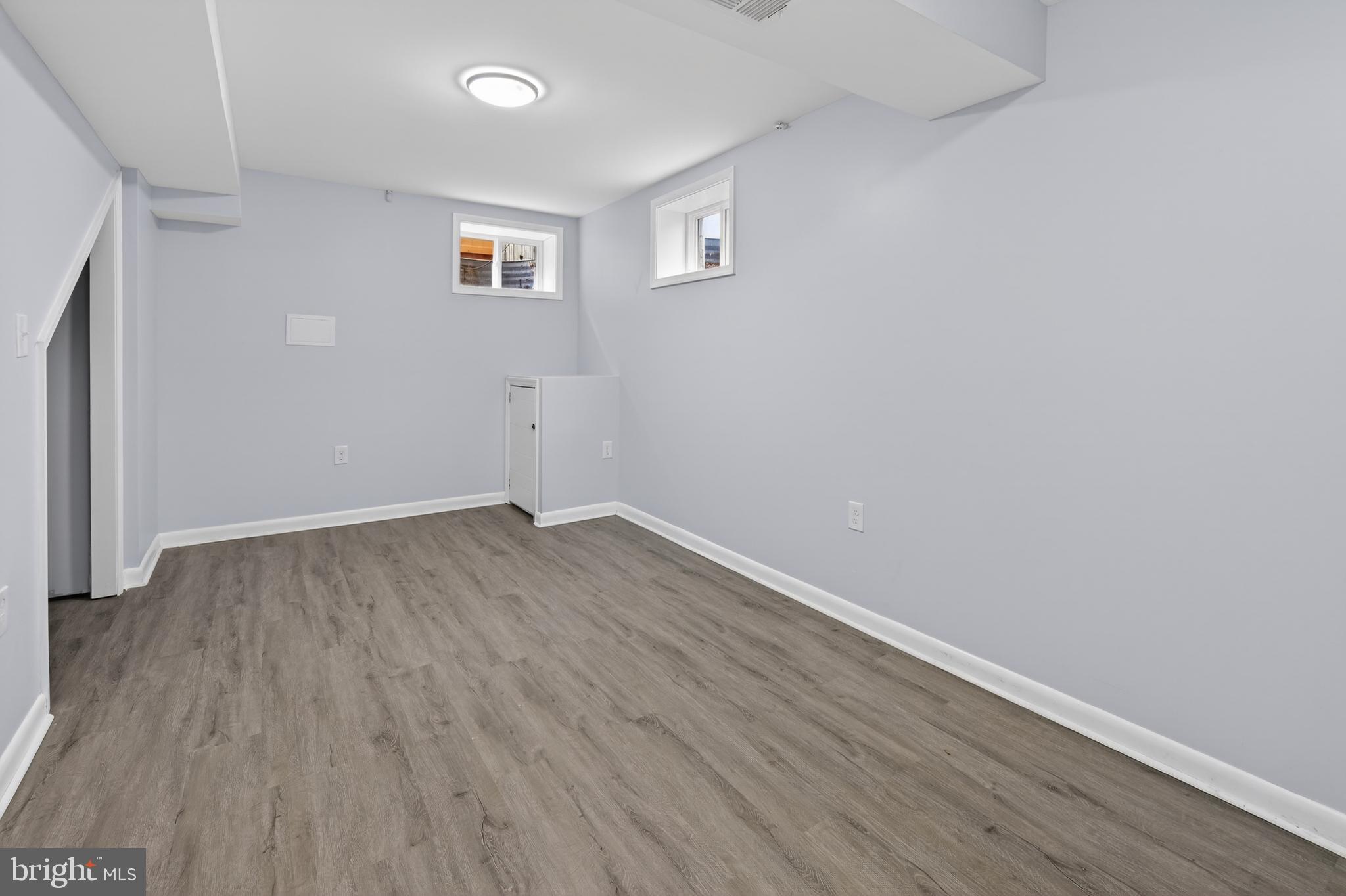 3505 N Street Southeast Washington, DC 20019 - Photo 16 of 29 a view of a room with wooden floor and a window