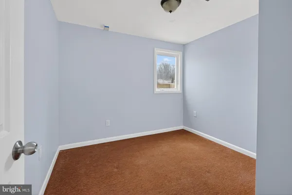 an empty room with a workbench