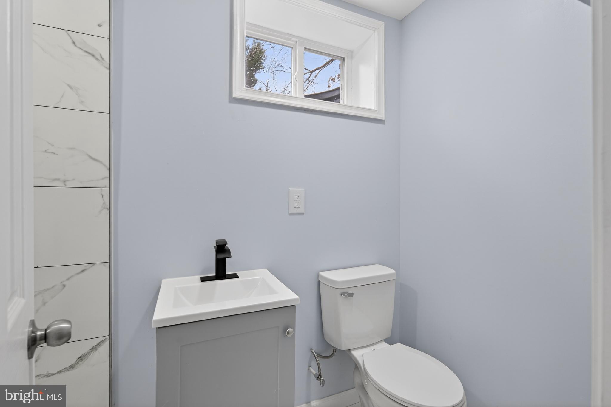 3505 N Street Southeast Washington, DC 20019 - Photo 24 of 29 a white toilet sitting next to a bathroom sink