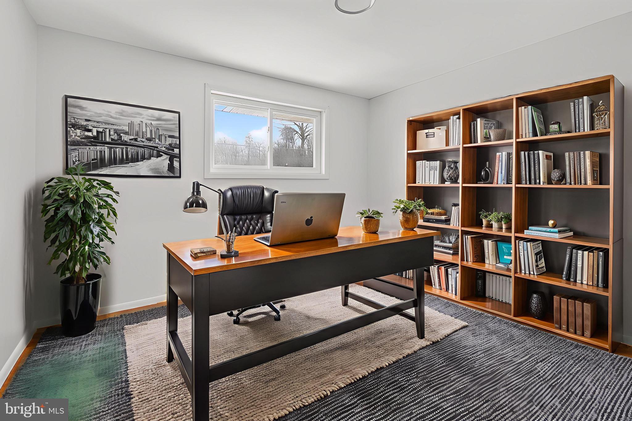 3505 N Street Southeast Washington, DC 20019 - Photo 9 of 29 a view of a workspace with a bookshelf and a workspace