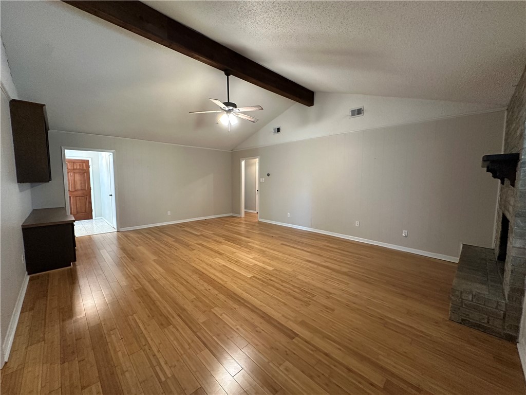 1506 Briar Street Portland, TX 78374 - Photo 7 of 40 a view of an empty room with wooden floor