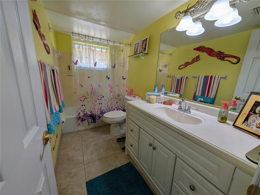 5934 Welcome Road, Unit H7 Bradenton, FL 34207 - Photo 13 of 23 a bathroom with a sink mirror and vanity