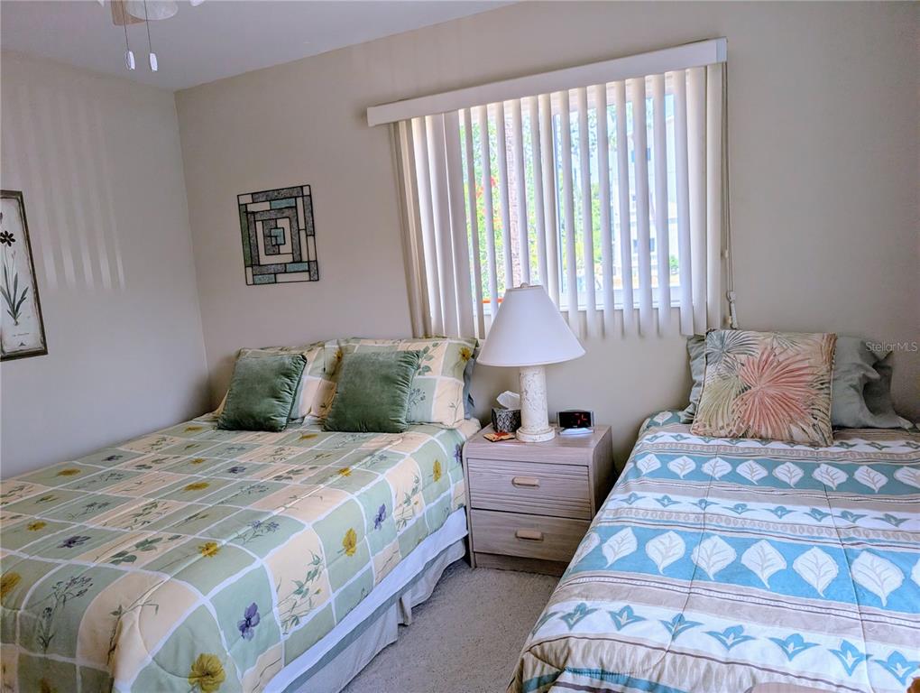 5934 Welcome Road, Unit H7 Bradenton, FL 34207 - Photo 15 of 23 a bedroom with bed and a window