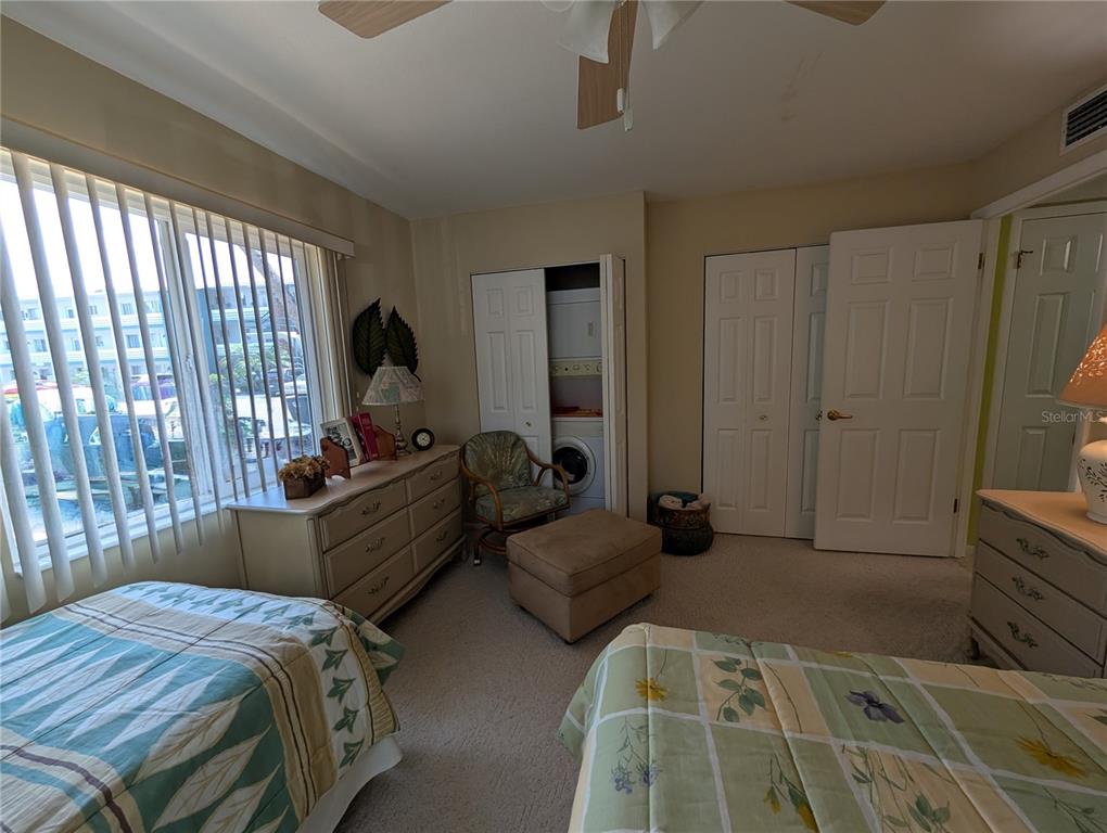 5934 Welcome Road, Unit H7 Bradenton, FL 34207 - Photo 16 of 23 a bed room with a bed and a dresser
