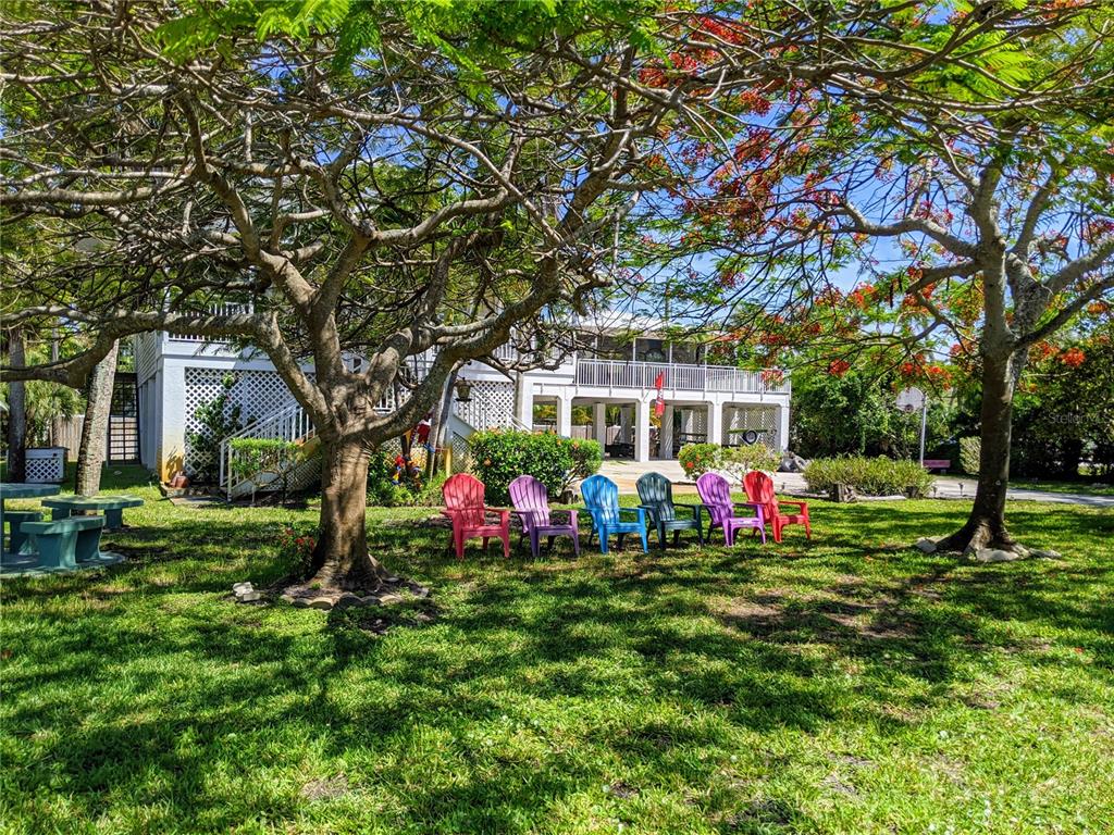 5934 Welcome Road, Unit H7 Bradenton, FL 34207 - Photo 21 of 23 a front view of a house with garden