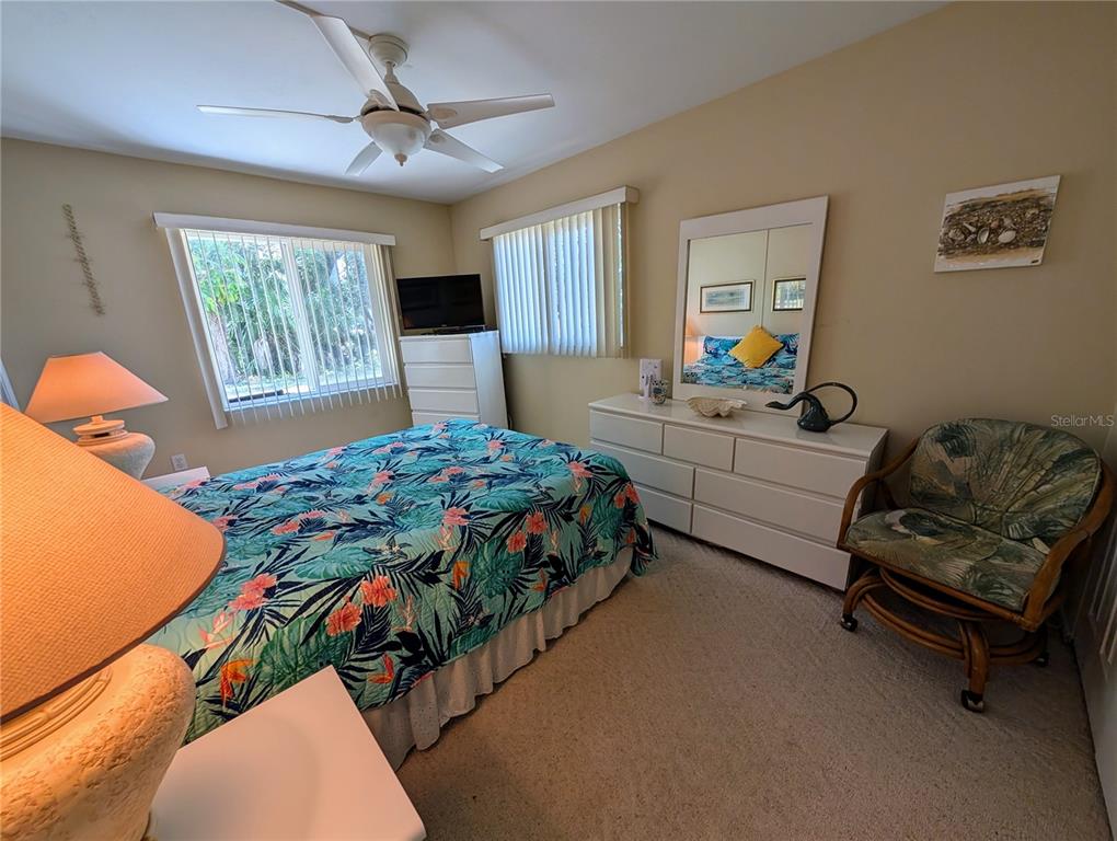 5934 Welcome Road, Unit H7 Bradenton, FL 34207 - Photo 8 of 23 a bedroom with a bed window and couch
