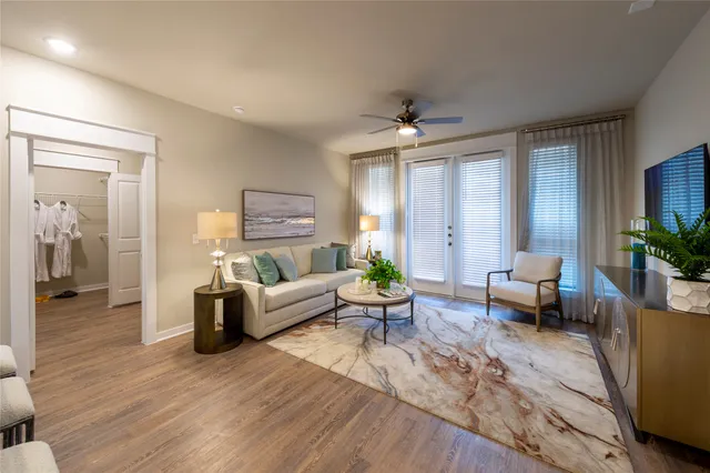 a living room with furniture and a large window