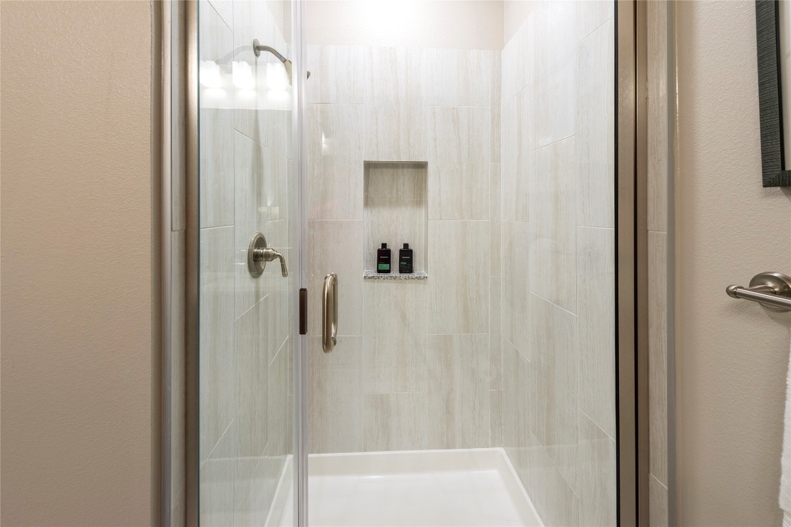 1724 Partnership Way, Unit 1362 Katy, TX 77449 - Photo 30 of 31 a bathroom with a glass shower door