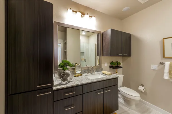a bathroom with a glass shower door