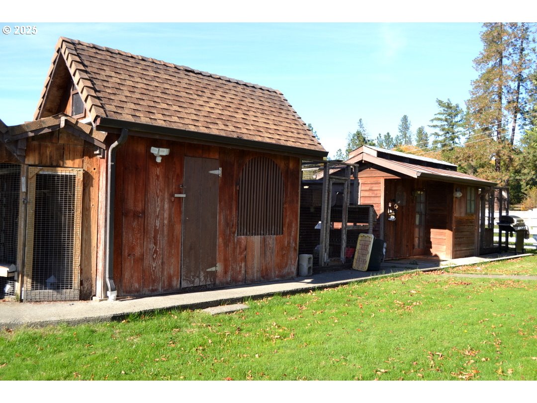 6181 Lower River Road Grants Pass, OR 97526 - Photo 19 of 37 a view of a house with a yard and sitting area