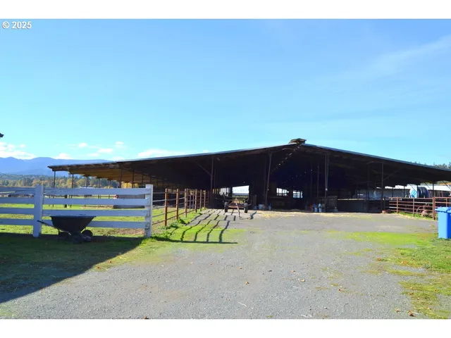a backyard of a house with barbeque oven
