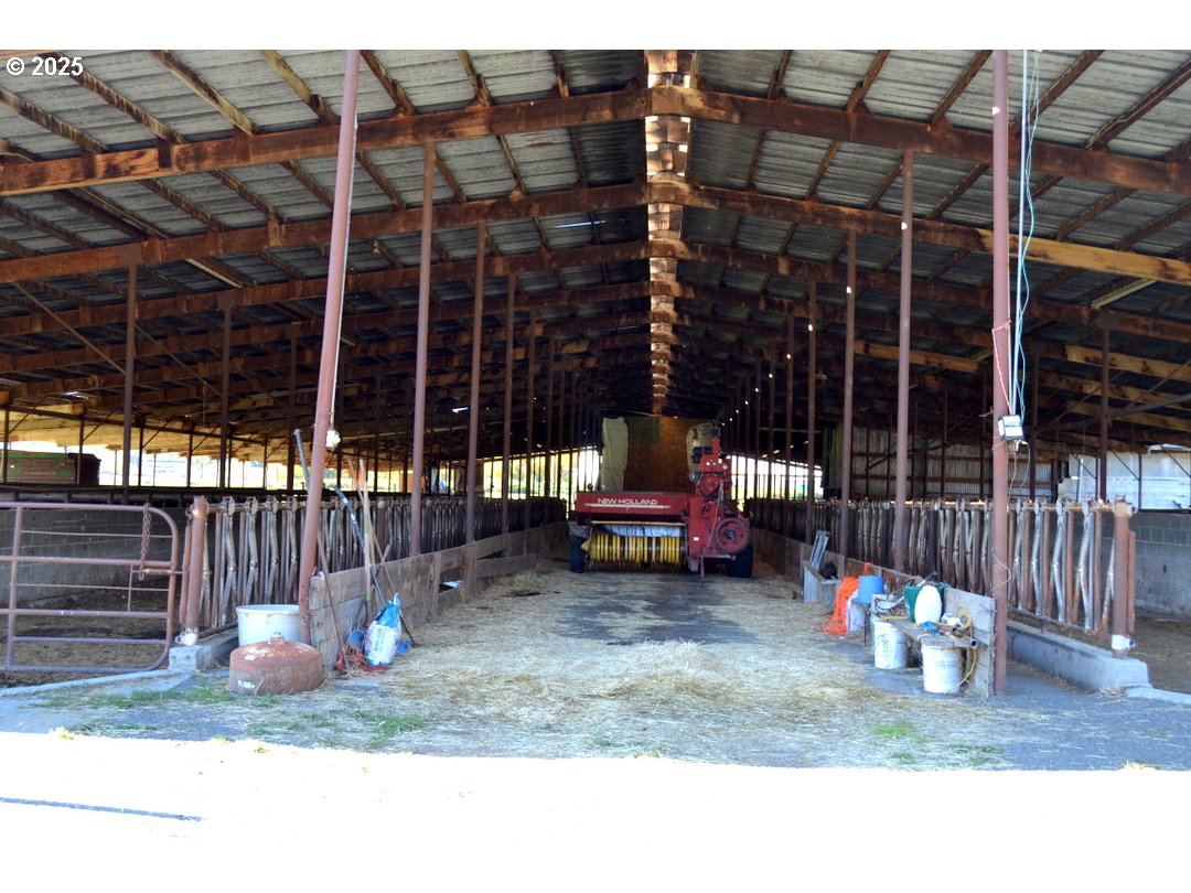 6181 Lower River Road Grants Pass, OR 97526 - Photo 22 of 37 a view of a house with a patio and a yard