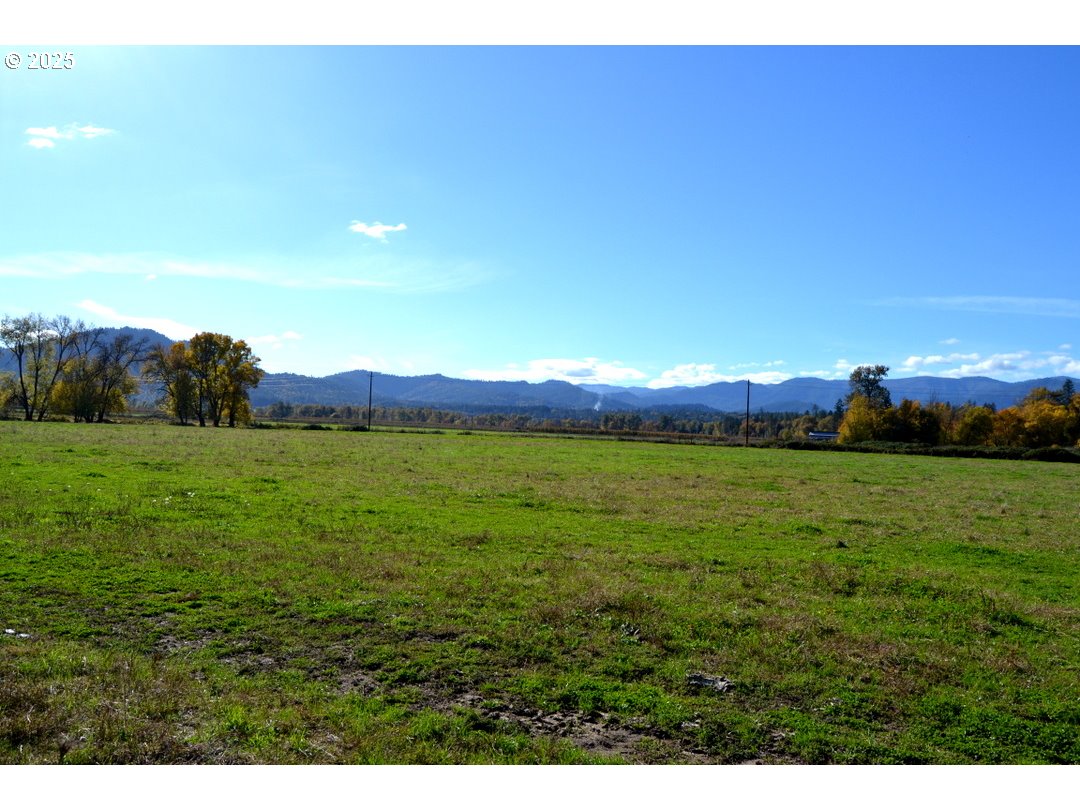 6181 Lower River Road Grants Pass, OR 97526 - Photo 25 of 37 a view of an ocean and a yard