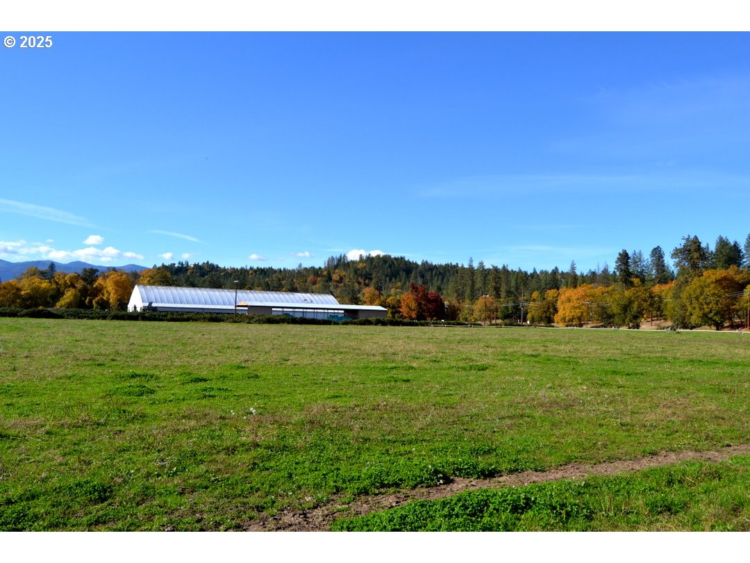 6181 Lower River Road Grants Pass, OR 97526 - Photo 26 of 37 a view of a grassy area with an ocean