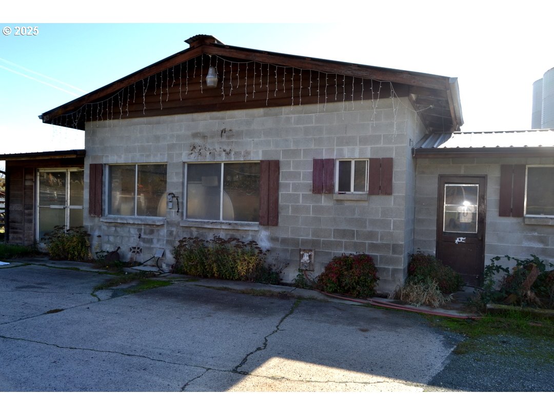 6181 Lower River Road Grants Pass, OR 97526 - Photo 28 of 37 a front view of a house with garden